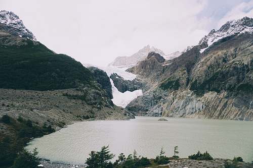 ice landscape photography of lake and moutnains mountain