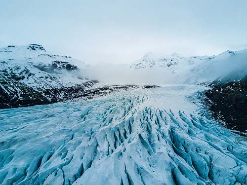 ice photo of snow covering moutain snow