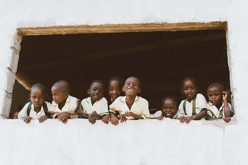 person children standing in front of window liberia