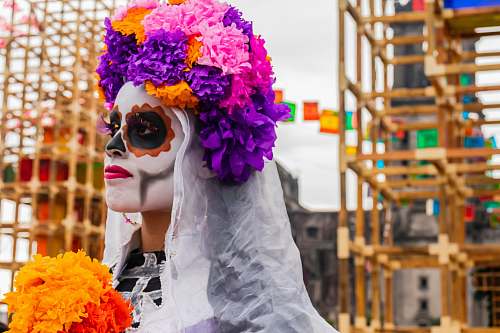 person person wearing flowers near scaffolding cdmx