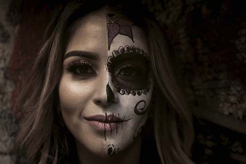 person woman with half-painted face people
