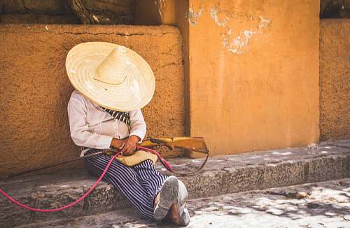 human person in white summer hat and brown rifle hat