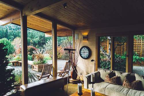  gray couch near door during daytime 