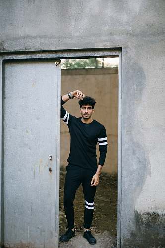  man standing in opened door 