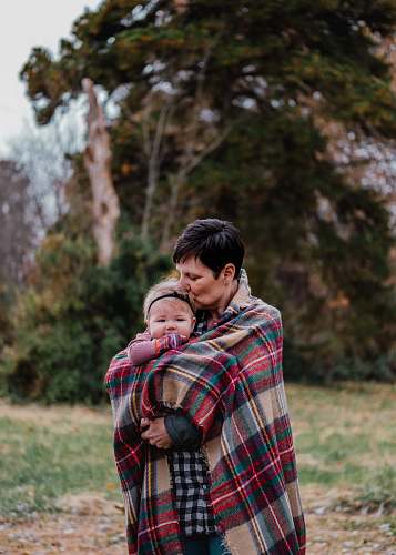 clothing woman carrying child plant