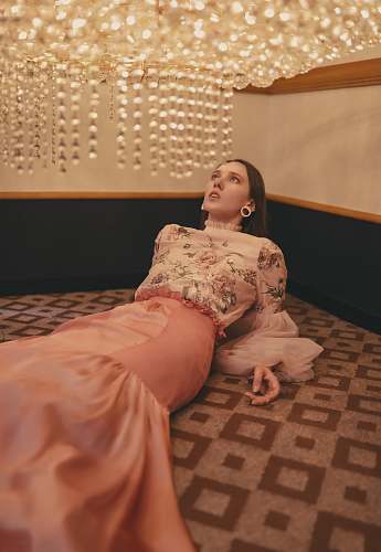 clothing woman lies in area rug fashion