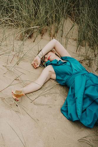 clothing woman lying on sand evening dress