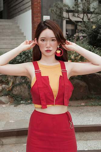 clothing woman touching ears fashion