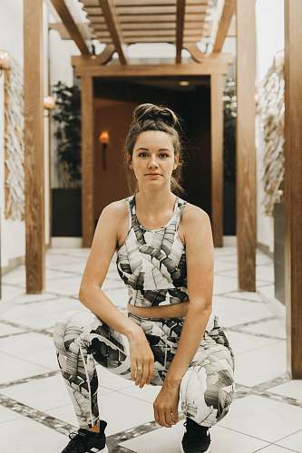 clothing woman wearing grey sleeveless rompers gown