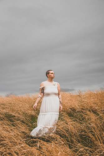 clothing woman wearing white spaghetti strap maxi dress gown