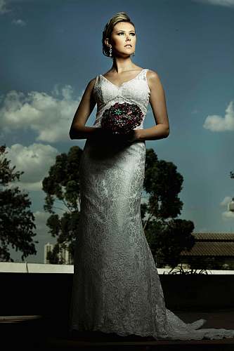 clothing woman wearing white wedding dress holding bouquet of flowers robe