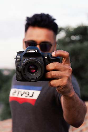 human black Canon EOS 80D person