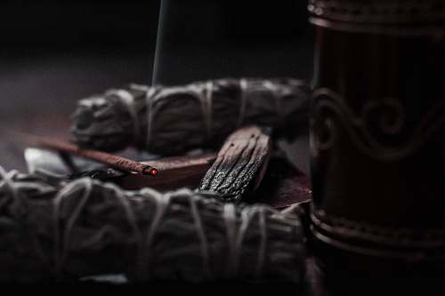 smoke shallow focus photography of lighted incense basket