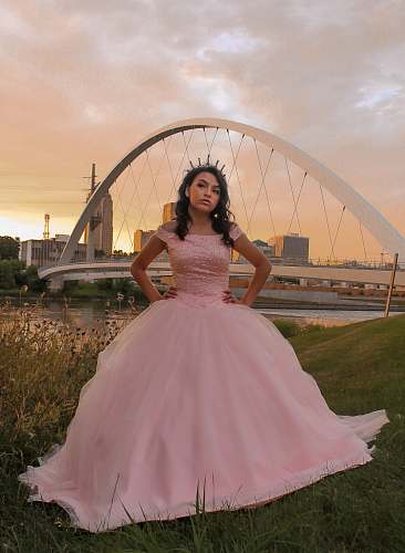 fashion woman standing near bridge apparel