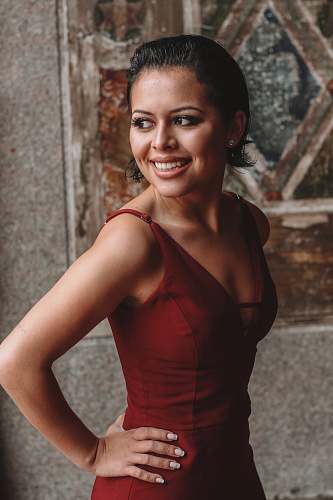 clothing smiling woman wearing red V-neck sleeveless dress evening dress