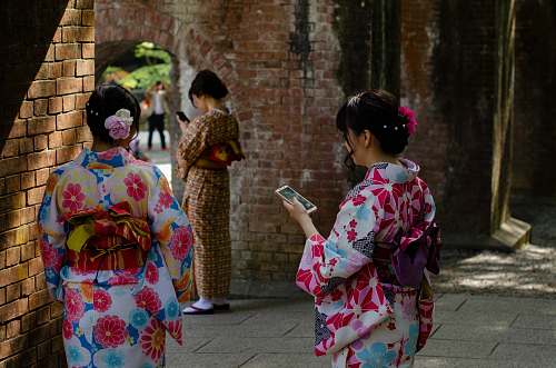 apparel three women wearing kimono dresses during daytime clothing