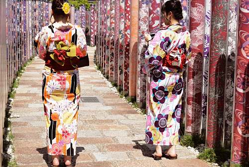 apparel two women wearing floral traditional dresses clothing