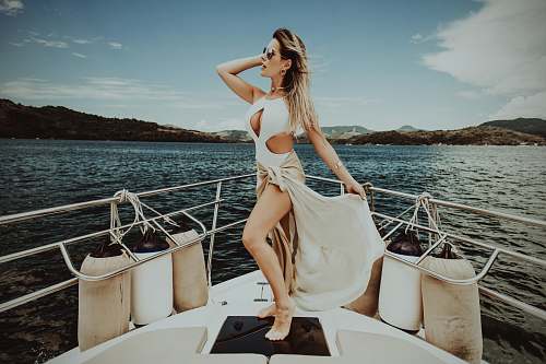 apparel woman standing on boat during daytime clothing