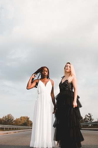 apparel woman wears white spaghetti strap dress clothing