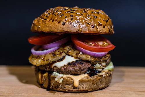 pineapple baked burger on brown surface burger