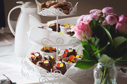 cake cupcakes on white metal cupcake stand dessert