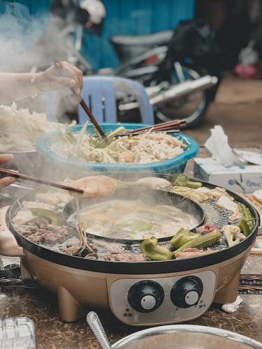 meal person cooking vegetables dish