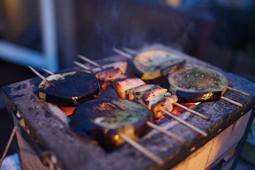 bbq three assorted barbeques on black grill skewers