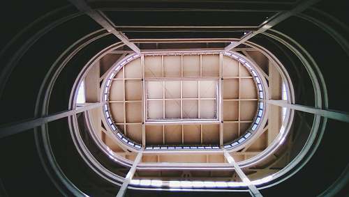 staircase low-angle photography of building banister