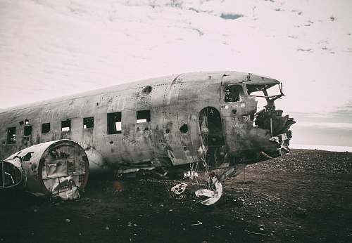 transportation grayscale photo of abandoned airliner in open field army