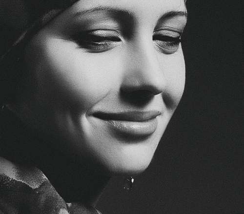 black-and-white grayscale photography of smiling woman face