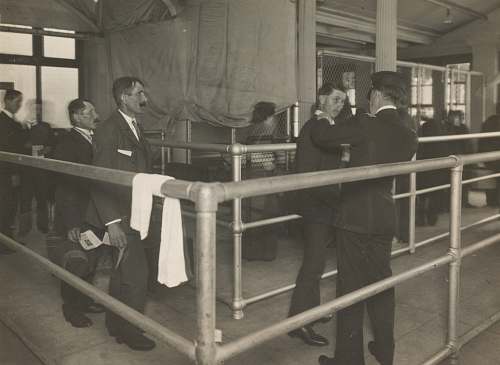 person greyscale photo of men ellis island