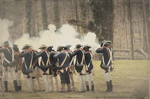 person people firing rifle during daytime military