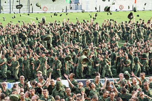 person people throwing hats military