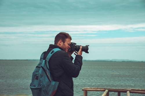 person person holding camera camera