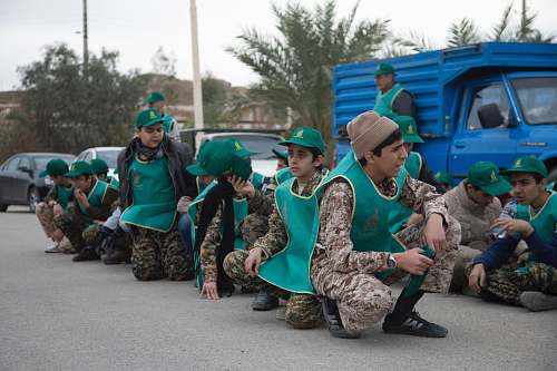 person soldier wearing green caps photo apparel