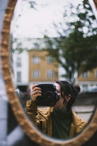 electronics woman holding camera camera