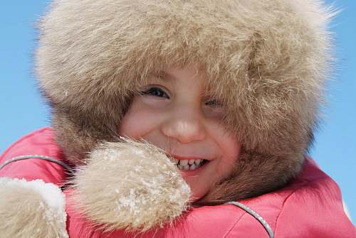 russia girl in pink and brown fur coat smiling fur hood