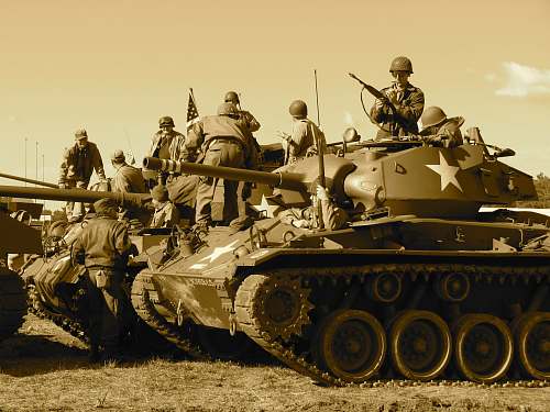 tank people sitting and standing on battle tank army