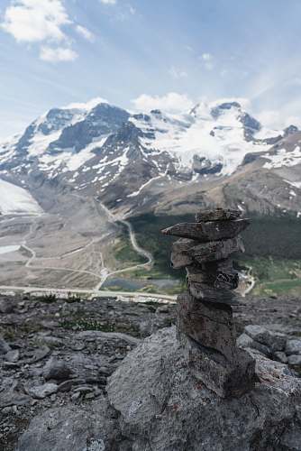 snow rock balancing during daytime nature