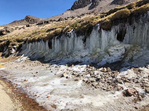outdoors stones on seashore ice