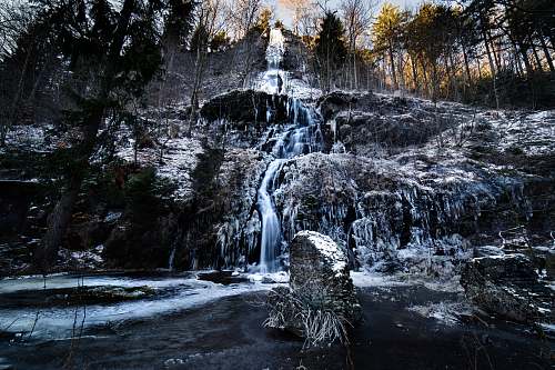 outdoors waterfalls cascading down rock wall river