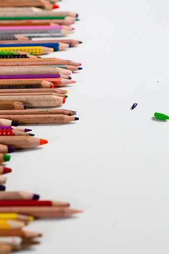 child color pencils on white surface colour