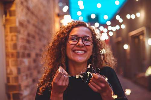 person woman standing near brick wall human