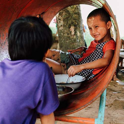 people boy smiling while looking at boy human