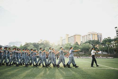 human group of men marching at the open field armored