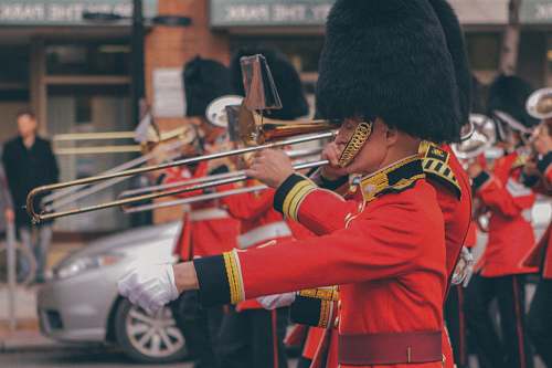 human man playing trombone people