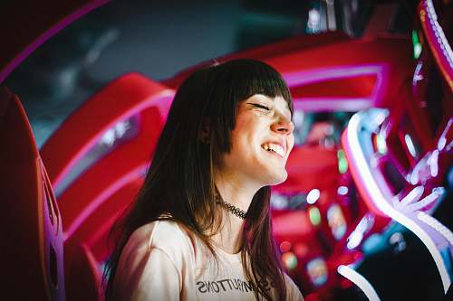 people photo of smiling woman wearing black choker human