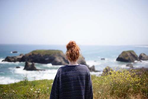 human woman looking at body of water people