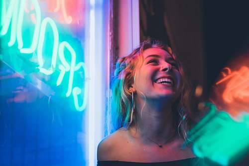 human woman standing beside neon light club