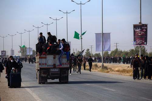 transportation people walking on paved road truck